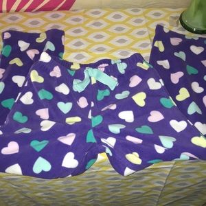 Girls size 5 purple fleece pants with multi colored hearts